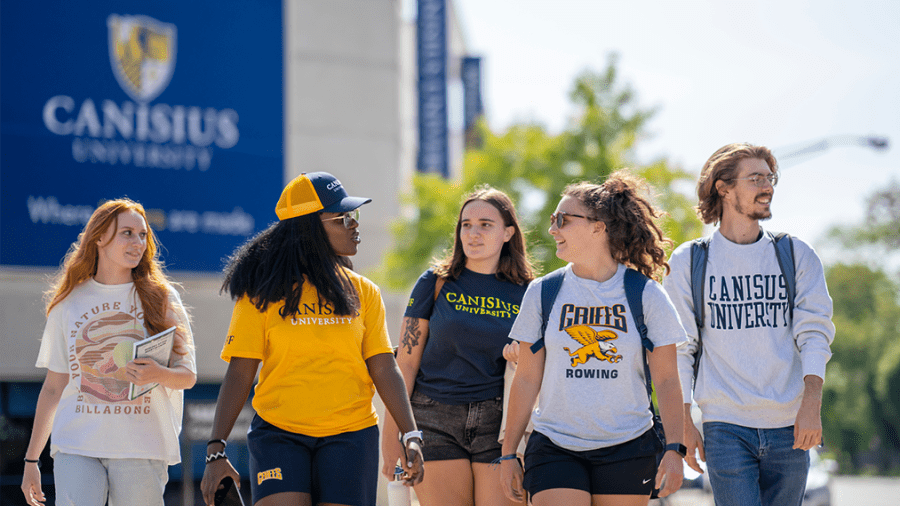 A group of Canisius students walk together down Main Street 