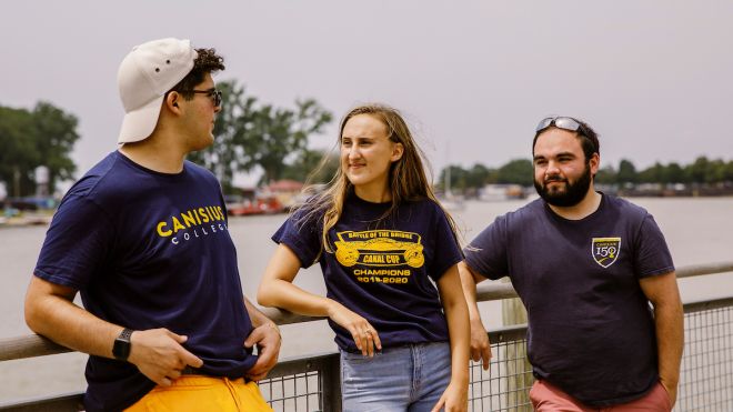 Three people standing outside